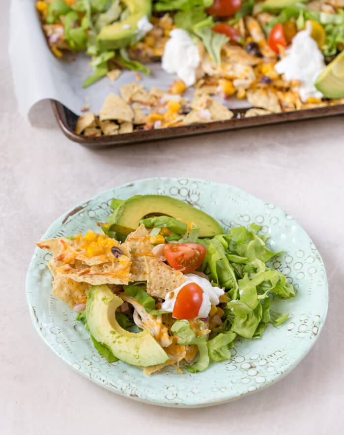 Love all the foods with tortilla chips and avocado... so naturally, Sheet Pan Chicken Nachos is a family favorite. It's one of those weeknight meals that we keep on rotation. 