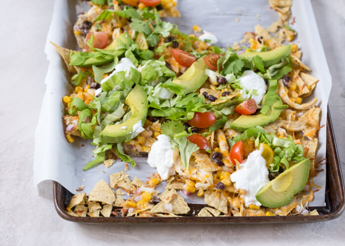 Love all the foods with tortilla chips and avocado... so naturally, Sheet Pan Chicken Nachos is a family favorite. It's one of those weeknight meals that we keep on rotation. 
