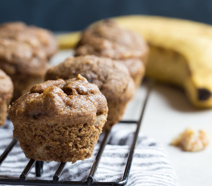 These Healthy Banana Bread Muffins with Walnuts are what dreams are made of! So moist and packed with that tasty banana flavor, these are incredibly easy banana bread muffins.