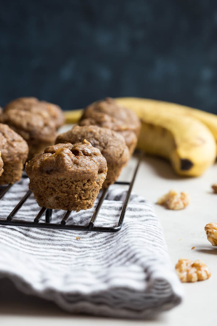 These Healthy Banana Bread Muffins with Walnuts are what dreams are made of! So moist and packed with that tasty banana flavor, these are incredibly easy banana bread muffins.