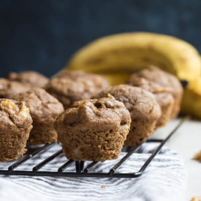 These Healthy Banana Bread Muffins with Walnuts are made with less sugar, whole wheat flour, and yes, that extra banana! We even subbed in maple syrup instead of white sugar into this recipe.