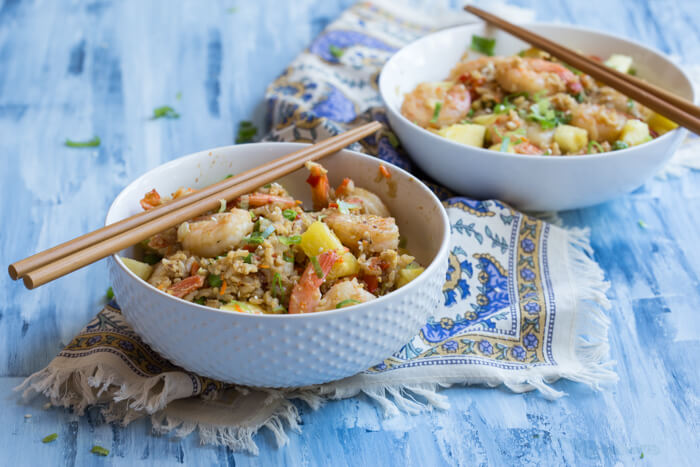 This Shrimp Cauliflower Fried Rice is ready in just 25 minutes! This is the perfect dish for a quick, need it in a hurry Monday through Friday meal or just as a healthier alternative to the standard cozy “take out and a movie” meal.