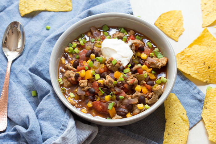 side shot of turkey taco soup with sour cream 