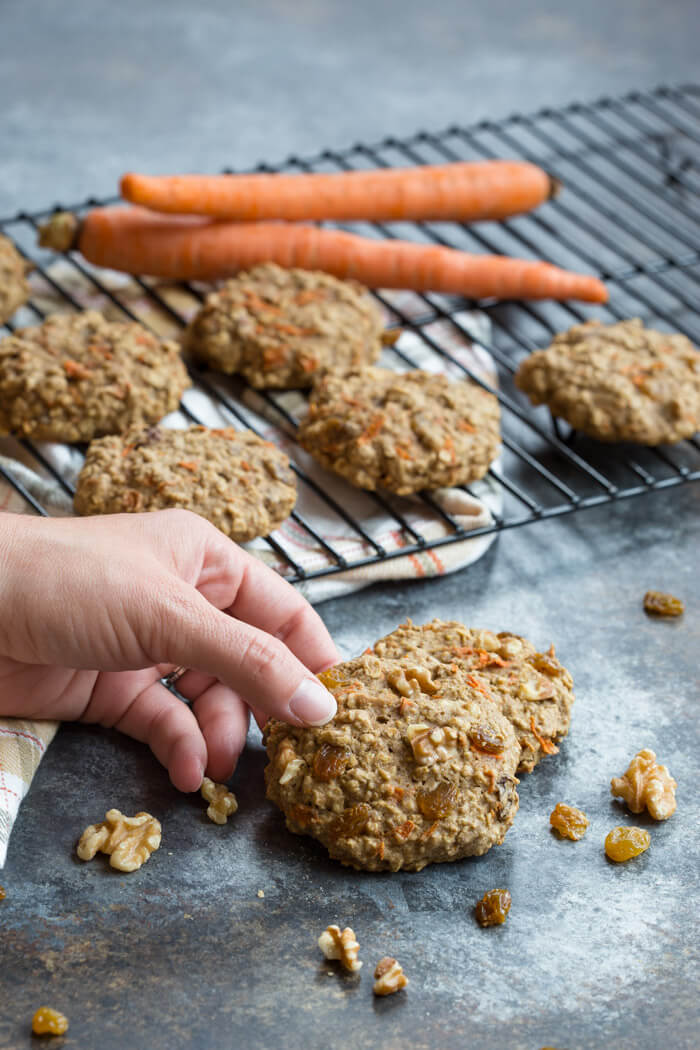 These Carrot Cake Breakfast Cookies are made with sweet carrots, oats, whole wheat flour, maple syrup, golden raisins and walnuts. Love all the healthy fats, whole grains, and veggies in these cookies! 