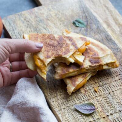 If you're looking for a simple comfort food dinner (or lunch) that tastes like fall-- this is it! Creamy Pumpkin Apple Quesadillas are perfect for little hands for snacking after school or before trick or treating. 