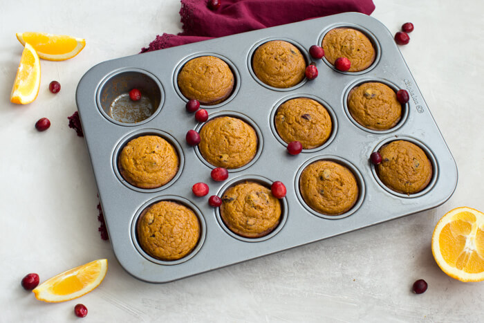 These gluten free Pumpkin Cranberry Orange Muffins are what I like to call "Morning Glory". They are an early morning, warm cup of chai tea with a splash of eggnog, and a cozy-blanket-snuggle-on-the-sofa type of muffins.