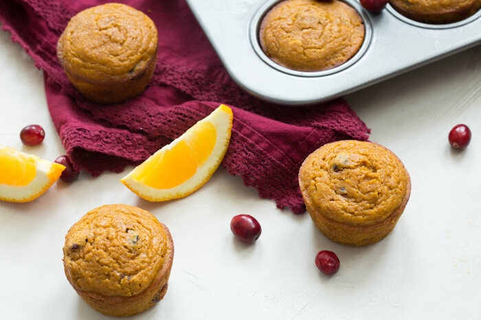 These gluten free Pumpkin Cranberry Orange Muffins are what I like to call "Morning Glory". They are an early morning, warm cup of chai tea with a splash of eggnog, and a cozy-blanket-snuggle-on-the-sofa type of muffins.