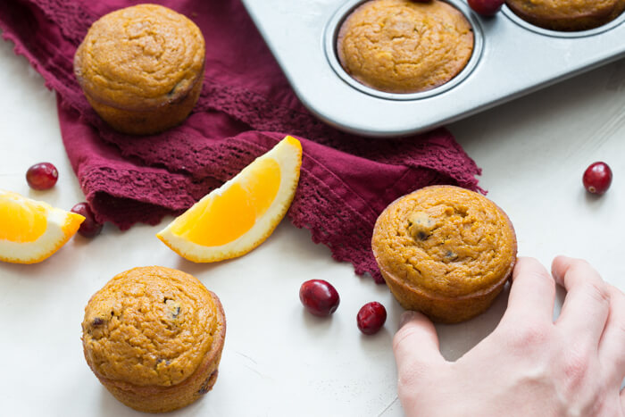 These gluten free Pumpkin Cranberry Orange Muffins are what I like to call "Morning Glory". They are an early morning, warm cup of chai tea with a splash of eggnog, and a cozy-blanket-snuggle-on-the-sofa type of muffins.