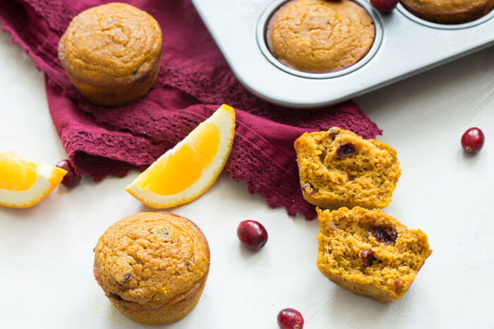 These gluten free Pumpkin Cranberry Orange Muffins are what I like to call "Morning Glory". They are an early morning, warm cup of chai tea with a splash of eggnog, and a cozy-blanket-snuggle-on-the-sofa type of muffins.