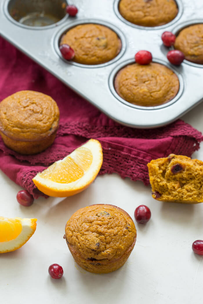 These gluten free Pumpkin Cranberry Orange Muffins are what I like to call "Morning Glory". They are an early morning, warm cup of chai tea with a splash of eggnog, and a cozy-blanket-snuggle-on-the-sofa type of muffins.