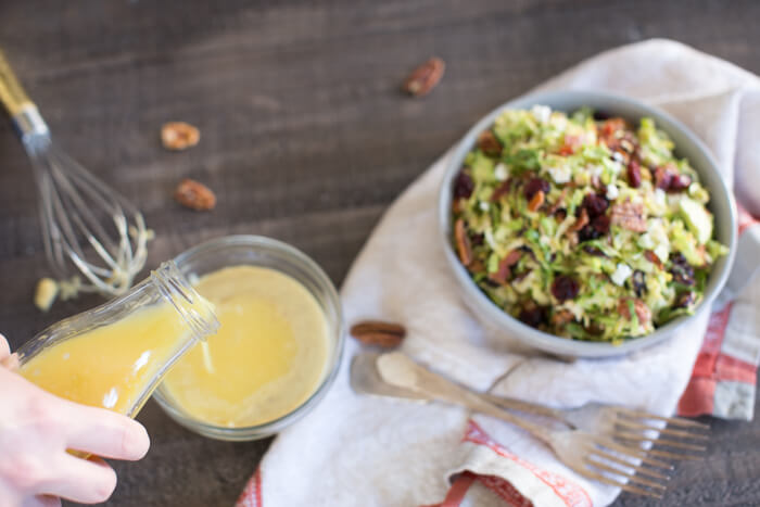Shaved Brussels Sprout Salad with Citrus Bacon Vinaigrette... the best hearty and nourishing winter side salad to add to your holiday menu. 