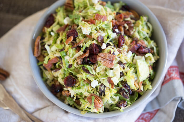 Shaved Brussels Sprout Salad with Citrus Bacon Vinaigrette... the best hearty and nourishing winter side salad to add to your holiday menu. 