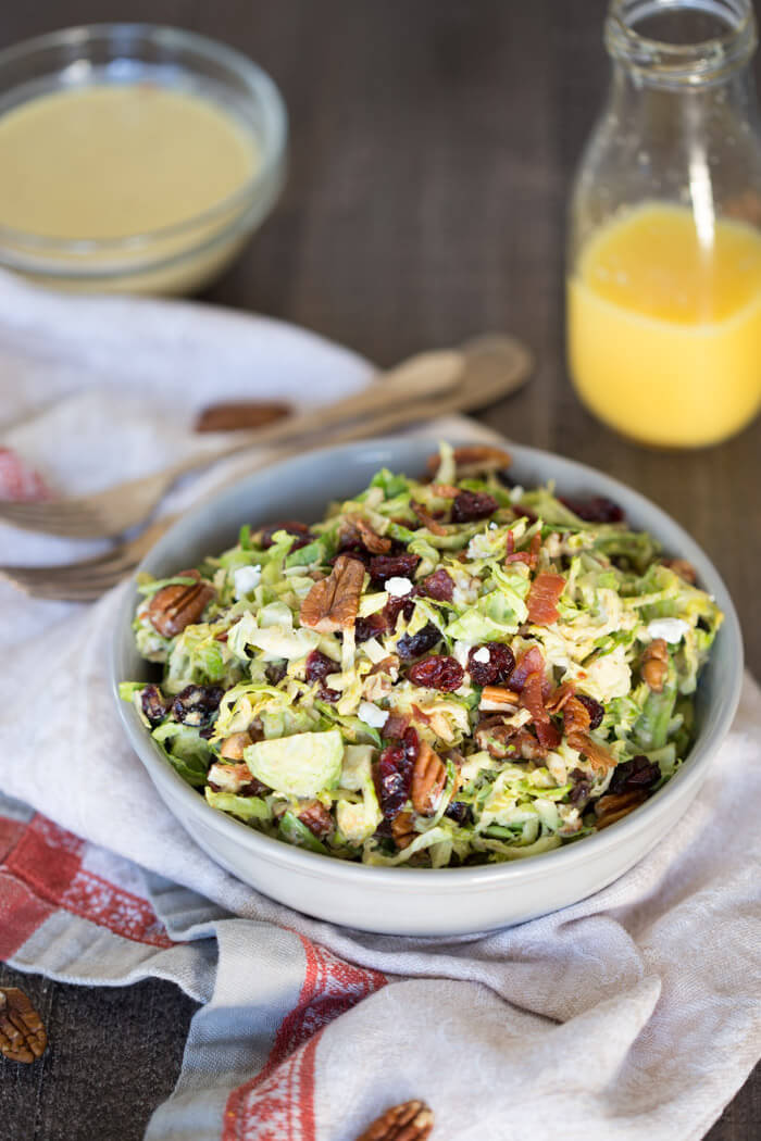 Shaved Brussels Sprout Salad with Citrus Bacon Vinaigrette... the best hearty and nourishing winter side salad to add to your holiday menu. 