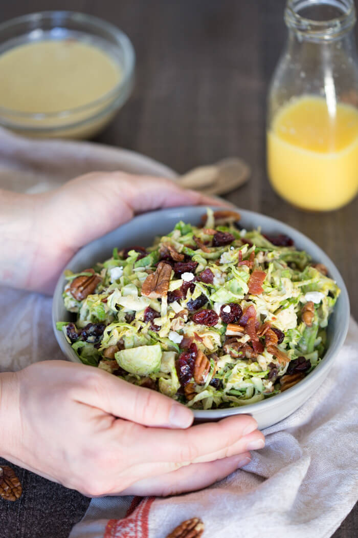 Shaved Brussels Sprout Salad with Citrus Bacon Vinaigrette... the best hearty and nourishing winter side salad to add to your holiday menu. 