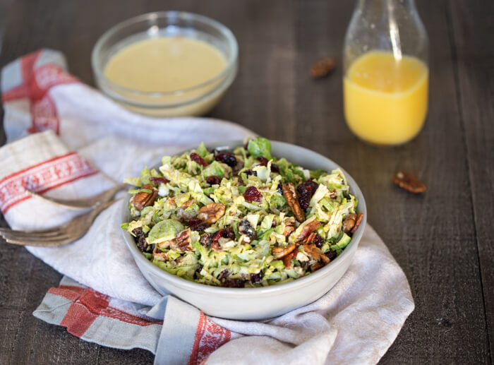 Shaved Brussels Sprout Salad with Citrus Bacon Vinaigrette... the best hearty and nourishing winter side salad to add to your holiday menu. 