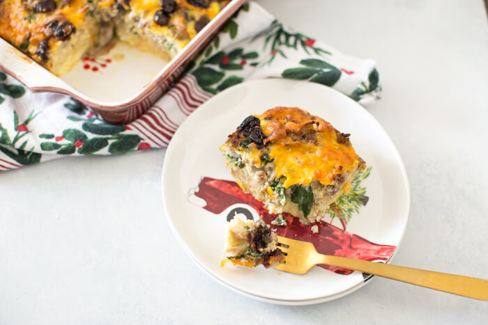 Christmas Breakfast Strata an easy overnight breakfast casserole made with eggs, sourdough bread, chard, mushrooms, and all dat cheese with cherries on top! 