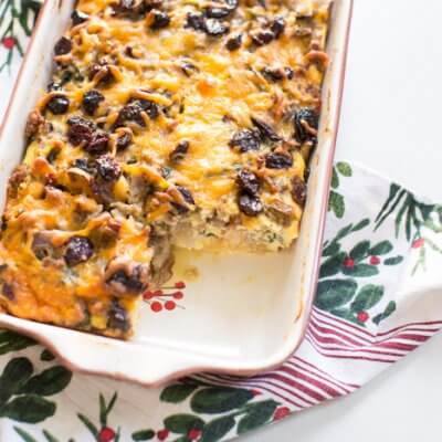 Christmas Breakfast Strata an easy overnight breakfast casserole made with eggs, sourdough bread, chard, mushrooms, and all dat cheese with cherries on top!