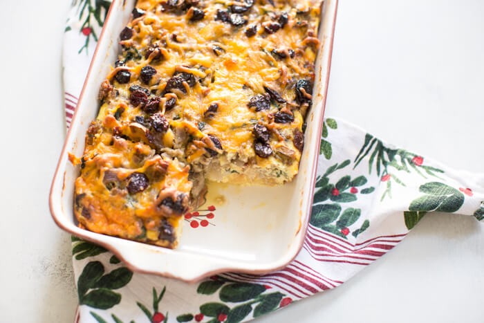 Christmas Breakfast Strata an easy overnight breakfast casserole made with eggs, sourdough bread, chard, mushrooms, and all dat cheese with cherries on top! 