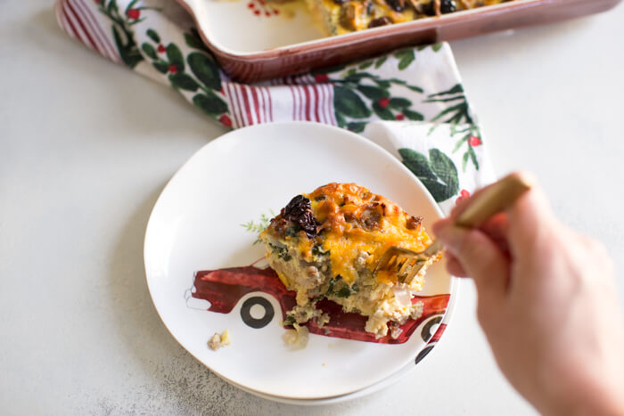 Christmas Breakfast Strata an easy overnight breakfast casserole made with eggs, sourdough bread, chard, mushrooms, and all dat cheese with cherries on top! 