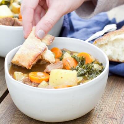 Drunken Potato Kale Beef Stew, a hearty guy friendly comfort food meal-- simple ingredients, minimal prep and a bottle of beer, what more could you want at dinner time?