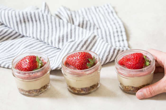 These Vegan Strawberry Cheesecake Minis are life right now. I love how simple ingredients can be made into a sweet treat in no time... right in the blender!