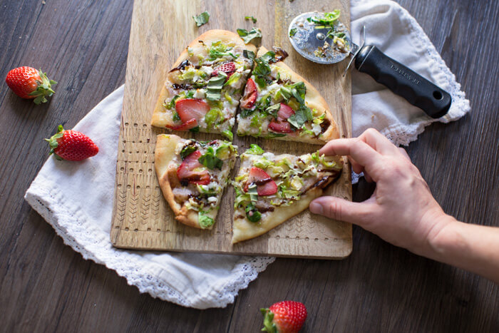 Strawberry Brussels Sprouts Naan Flatbread an easy appetizer or main made that's sweet and savoy. Warm naan bread loaded with shaved Brussels sprouts, strawberry mascarpone, fresh strawberries, and a tangy balsamic drizzle. So good. 