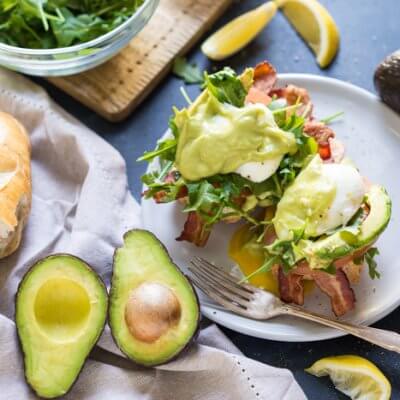 Eggs Benedict BLT with Avocado Hollandaise, a hearty comforting breakfast recipe that's packed with nutrition thanks to avocados.