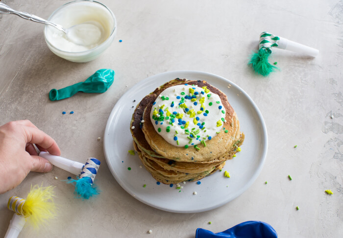 Cake for breakfast... heck yes! Birthday Cake Pancakes that tastes like you're licking cake batter right out of the bowl... with sprinkles of course.