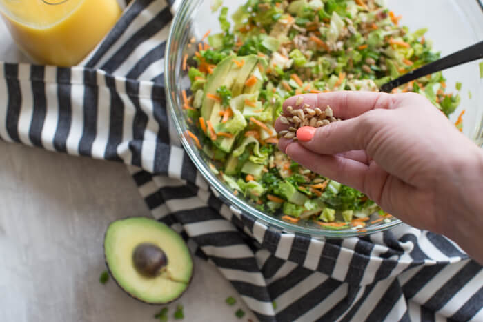 OH ME OH MY! This Farmhouse Chicken Chopped Salad with romaine, cabbage, kale, carrots, grilled chicken breast, bacon, sunflower seeds and avocado tossed in a tangy orange honey mustard dressing is my jam.