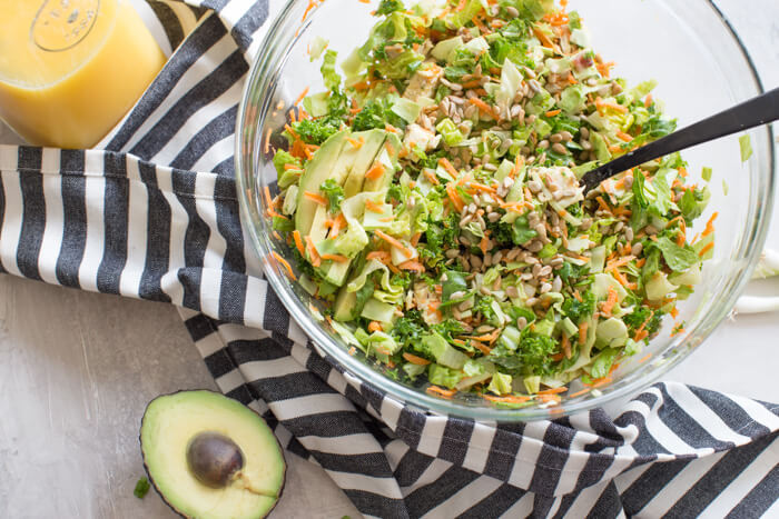 OH ME OH MY! This Farmhouse Chicken Chopped Salad with romaine, cabbage, kale, carrots, grilled chicken breast, bacon, sunflower seeds and avocado tossed in a tangy orange honey mustard dressing is my jam.