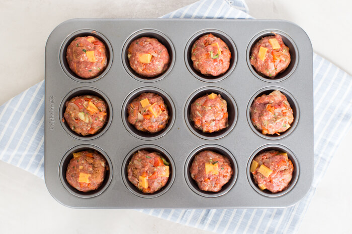 Cheesy Meatloaf Minis made in the muffin tin and full of hidden veggies. Freezer friendly, family friendly weeknight meal that's gluten free.