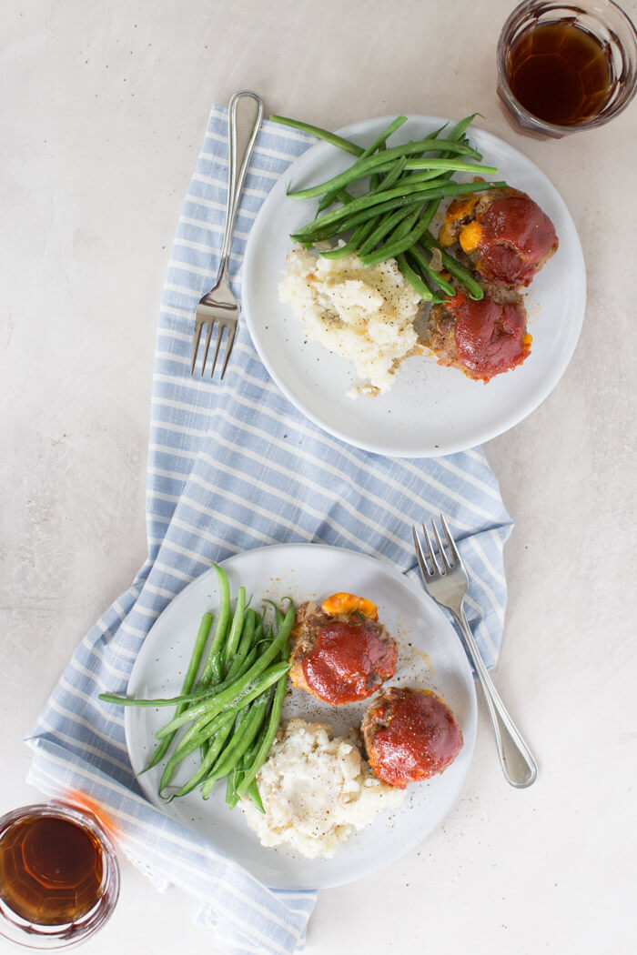 Cheesy Meatloaf Minis made in the muffin tin and full of hidden veggies. Freezer friendly, family friendly weeknight meal that's gluten free.