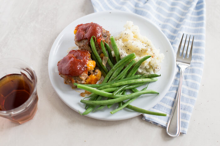 Cheesy Meatloaf Minis made in the muffin tin and full of hidden veggies. Freezer friendly, family friendly weeknight meal that's gluten free.