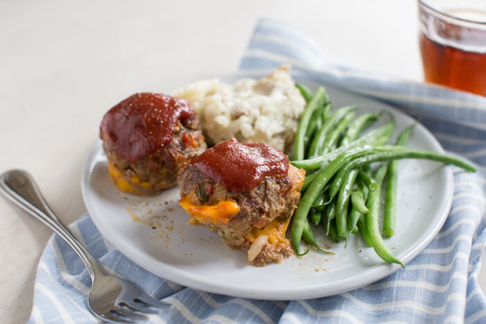 Cheesy Meatloaf Minis made in the muffin tin and full of hidden veggies. Freezer friendly, family friendly weeknight meal that's gluten free.