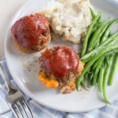 Cheesy Meatloaf Minis made in the muffin tin and full of hidden veggies. Freezer friendly, family friendly weeknight meal that's gluten free.