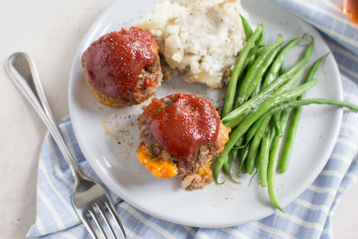 Cheesy Meatloaf Minis made in the muffin tin and full of hidden veggies. Freezer friendly, family friendly weeknight meal that's gluten free.