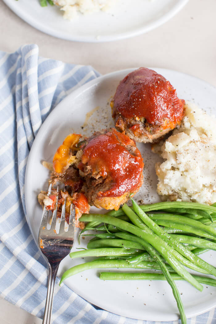 Cheesy Meatloaf Minis made in the muffin tin and full of hidden veggies. Freezer friendly, family friendly weeknight meal that's gluten free.