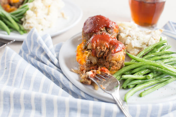 Cheesy Meatloaf Minis made in the muffin tin and full of hidden veggies. Freezer friendly, family friendly weeknight meal that's gluten free.