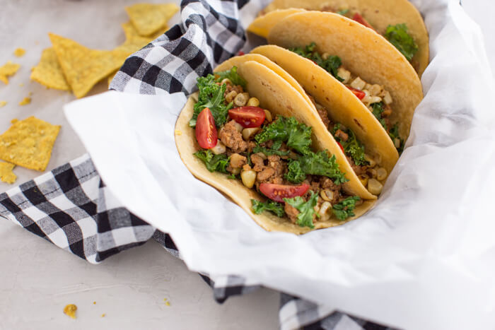 Superfood Turkey Tacos a family favorite with an extra dose of veggies that you can't see. :) Ground turkey tacos sautéed with super tiny mushrooms, walnuts, and cauliflower rice to make a mostly plant based meaty meal.