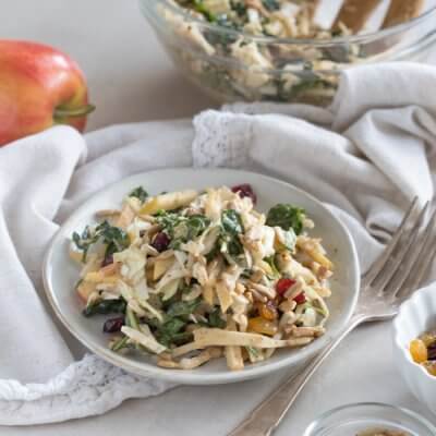 Apple Crunch Slaw with Almond Butter Dressing... yep, let's talk legit fall food over here. We love the crunch in this plant-based salad from all the shredded veggies, apples, and sunflower seeds.