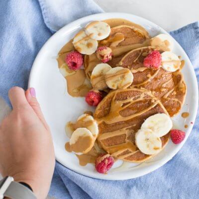 These fluffy peanut butter protein pancakes are protein packed with cottage cheese and peanut powder and made straight in the blender for easy mixing. Meal prep these peanut butter protein pancakes to freeze and reheat for quick breakfast, brinner, or pre/post workout fuel. 