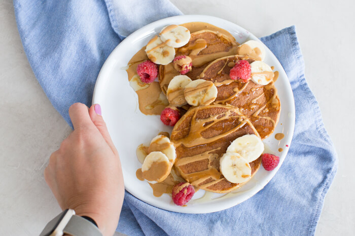 These fluffy peanut butter protein pancakes are protein packed with cottage cheese and peanut powder and made straight in the blender for easy mixing. Meal prep these peanut butter protein pancakes to freeze and reheat for quick breakfast, brinner, or pre/post workout fuel. 