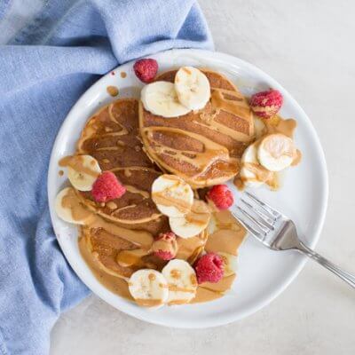 These fluffy peanut butter protein pancakes are protein packed with cottage cheese and peanut powder and made straight in the blender for easy mixing. Meal prep these peanut butter protein pancakes to freeze and reheat for quick breakfast, brinner, or pre/post workout fuel. 