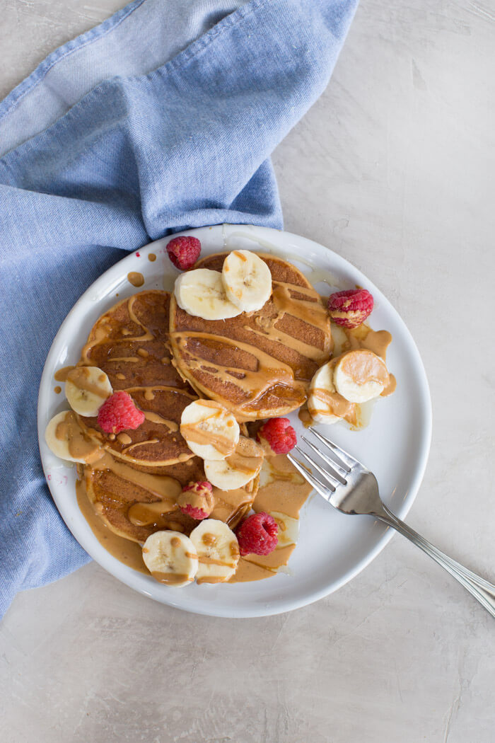 These fluffy peanut butter protein pancakes are protein packed with cottage cheese and peanut powder and made straight in the blender for easy mixing. Meal prep these peanut butter protein pancakes to freeze and reheat for quick breakfast, brinner, or pre/post workout fuel. 