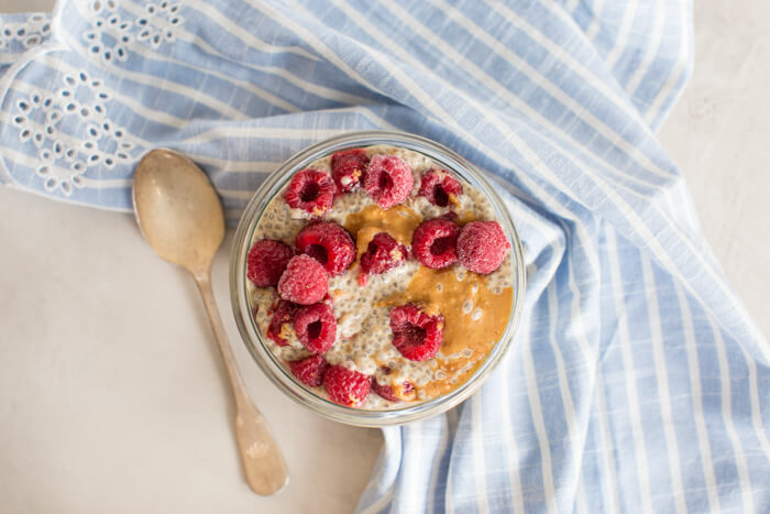 overhead shot of peanut butter chia pudding with spoon