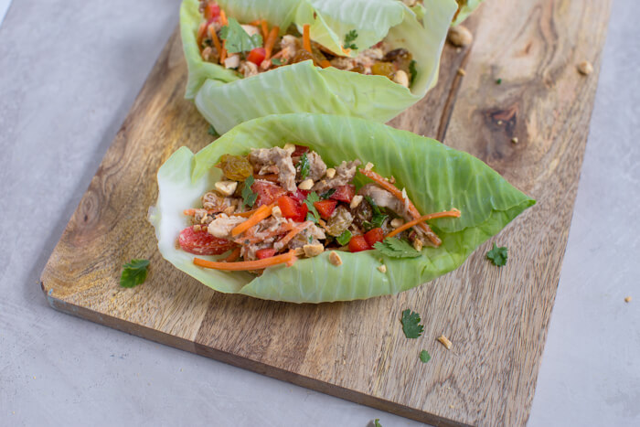 Thai chicken recipe with carrots, bell peppers, and peanuts 