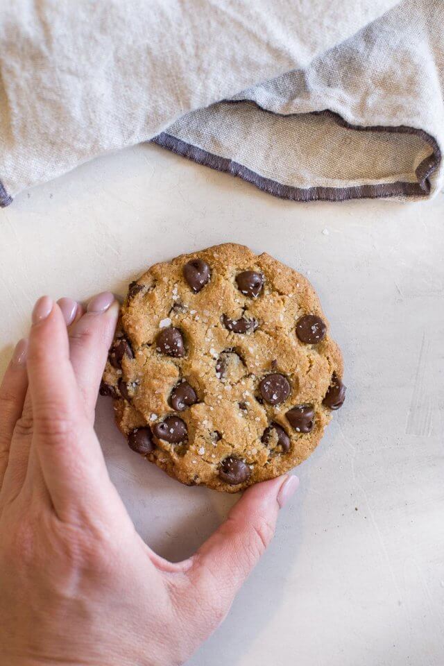 hand reaching for Almond Flour Chocolate Chip Cookies