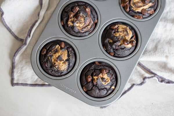 chocolate chip banana muffins in muffin pan