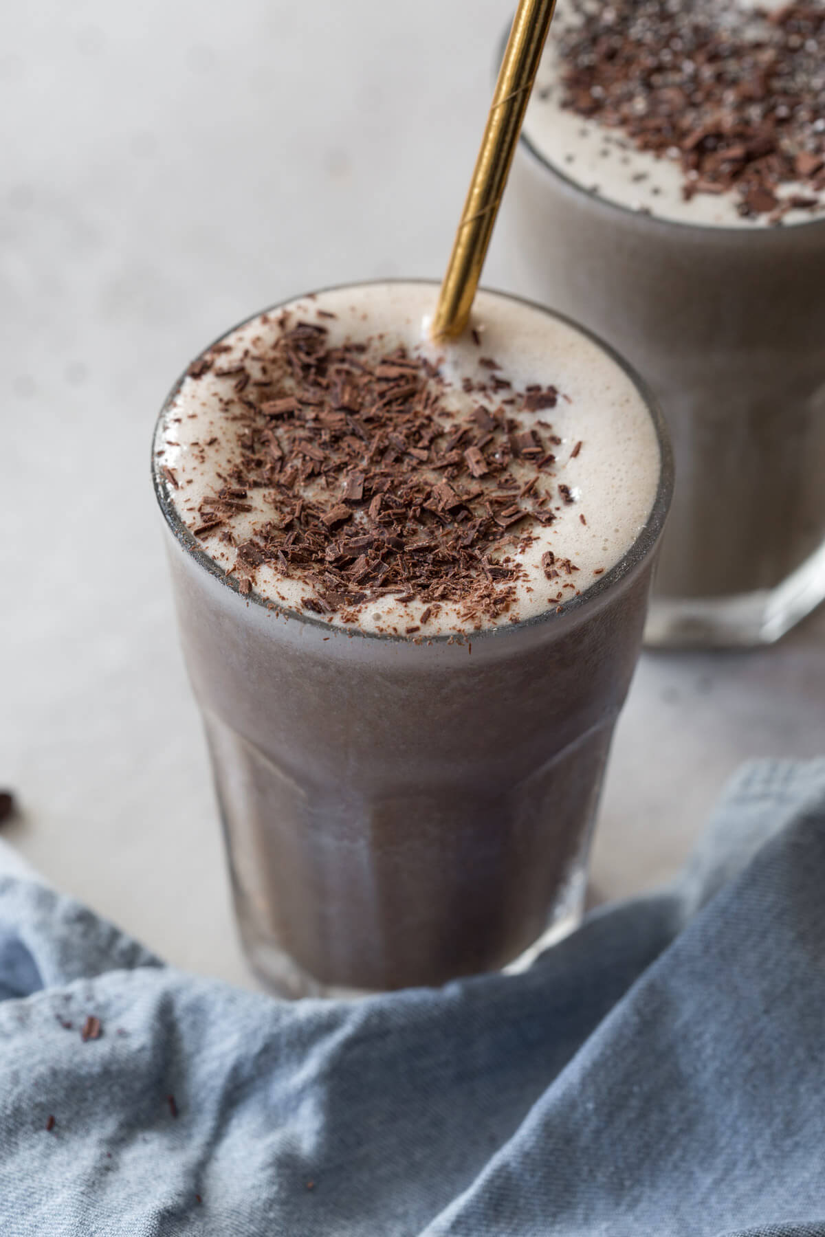 low sugar chocolate protein shake with chocolate shavings on top