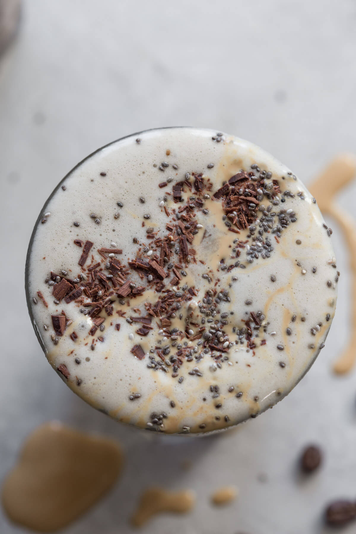overhead shot of low sugar coffee shake topped with chocolate shavings and peanut butter